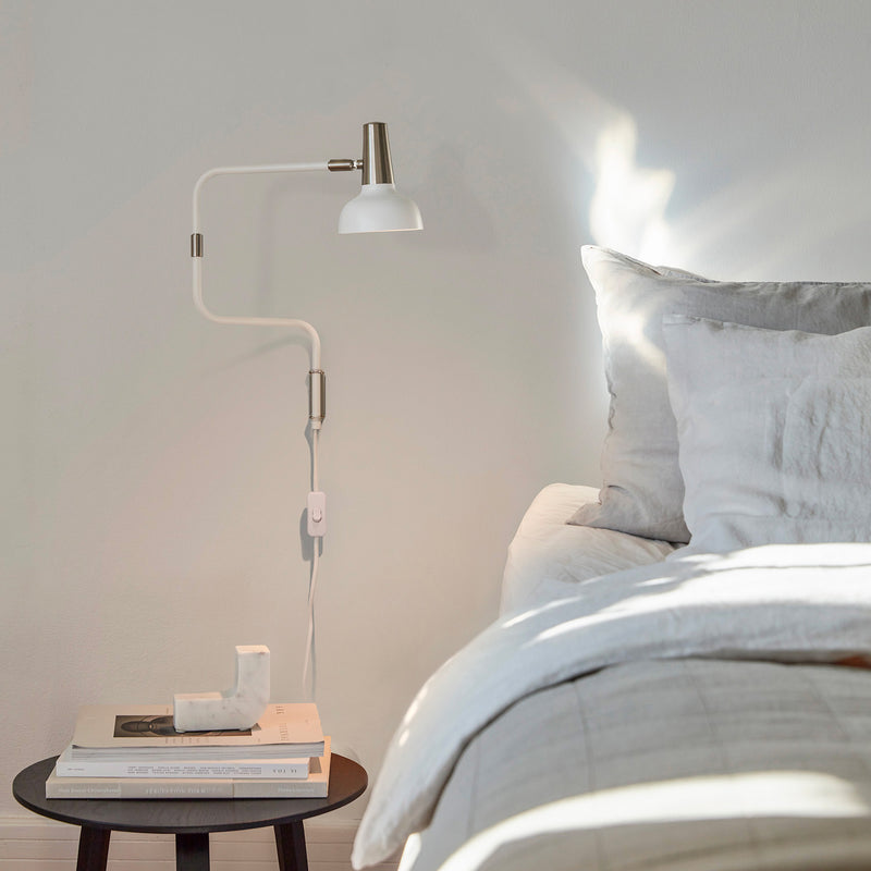 RAY - Designer adjustable wall light for bedroom, black or white